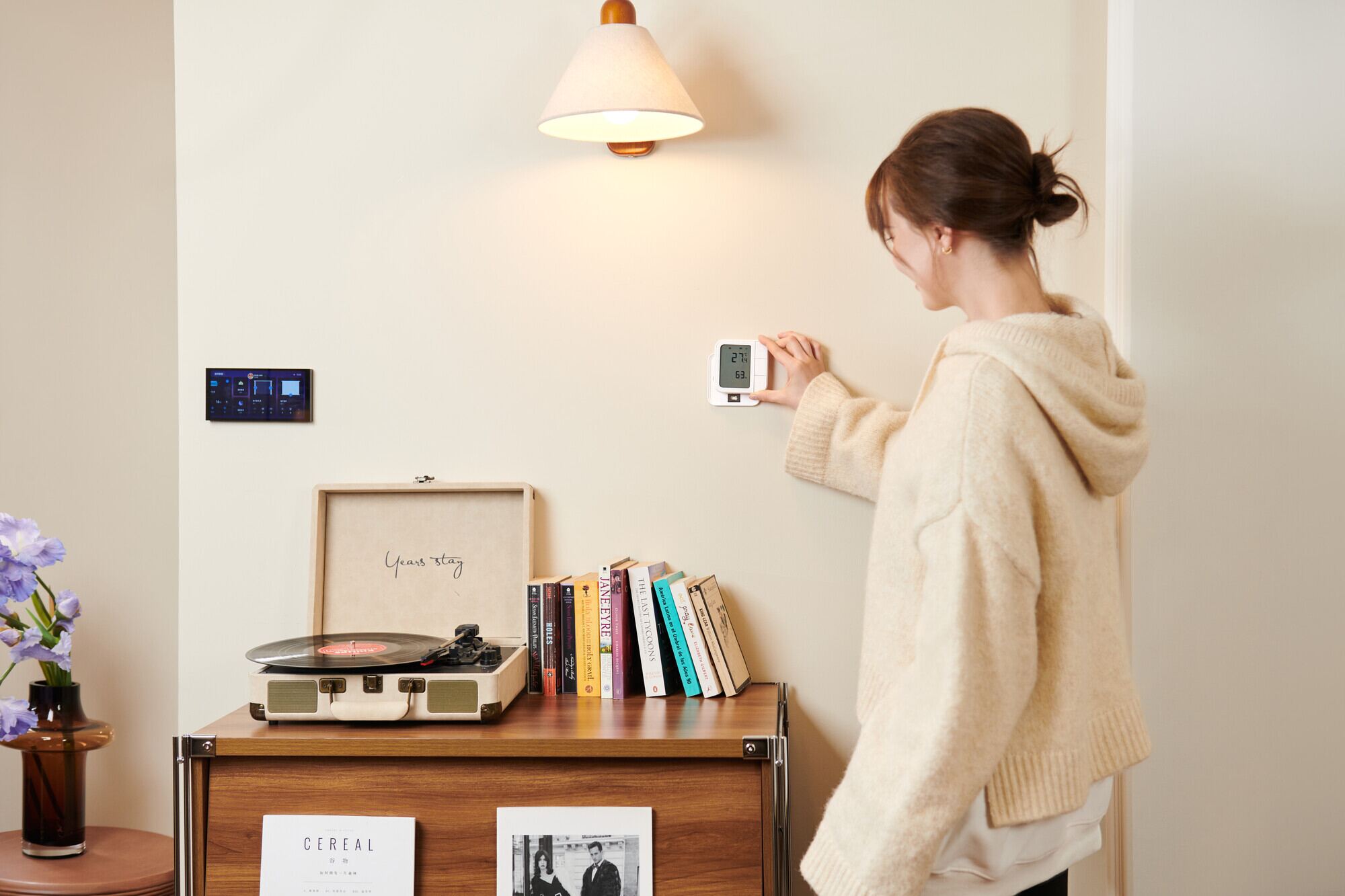 Resident checking Aqara climate and smart home controls